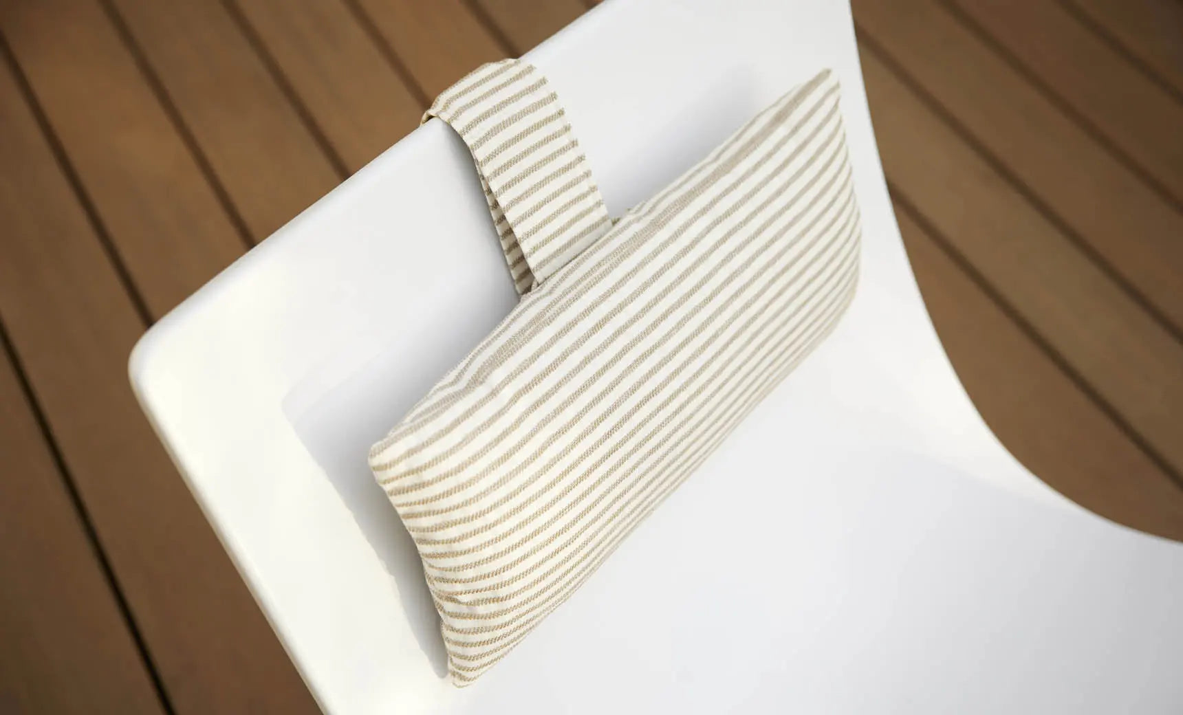 Autograph headrest pillow with soft fabric cover and adjustable design for comfortable neck support during travel.