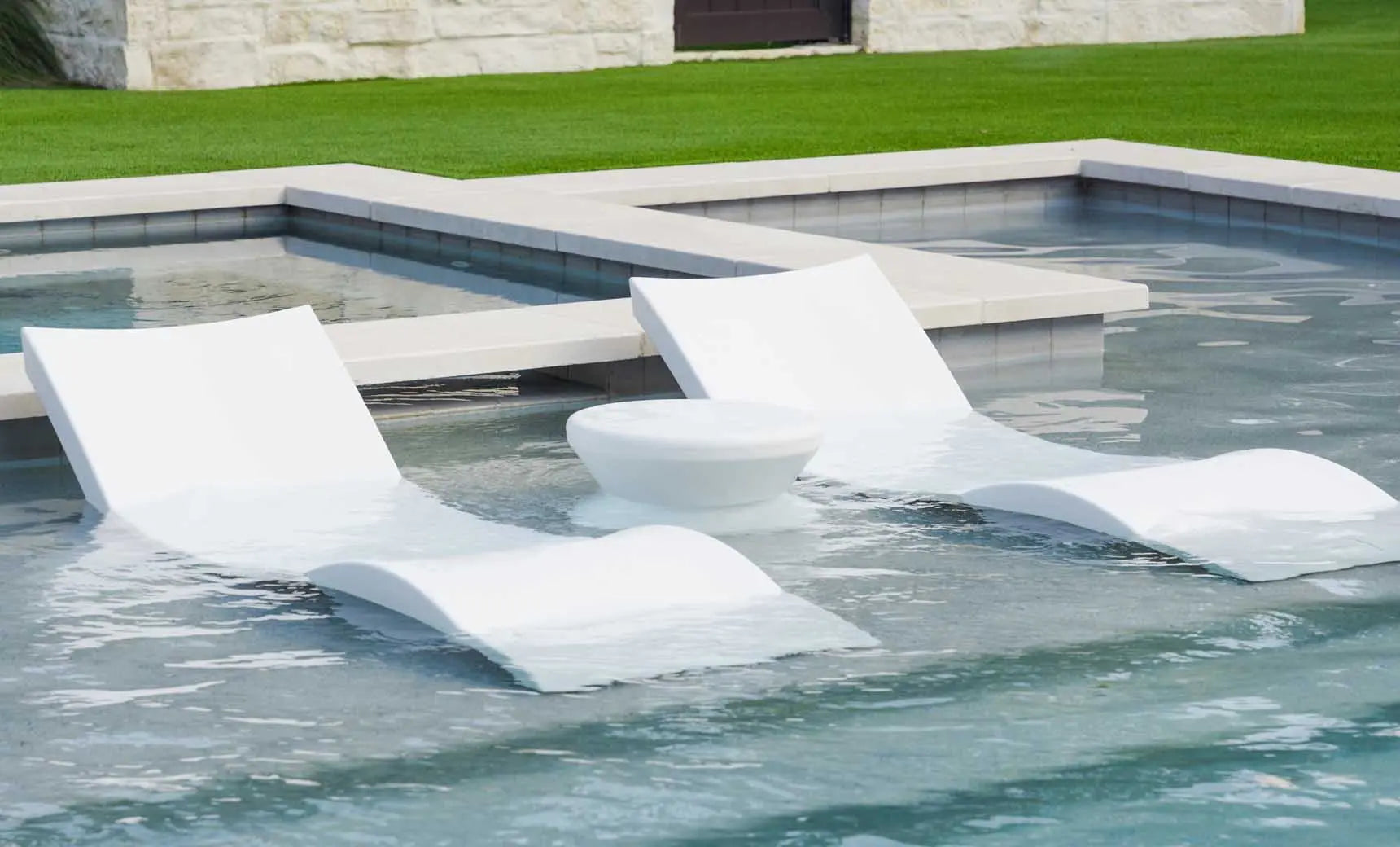 Signature pool chaise lounge set with coordinating side table in a modern design.