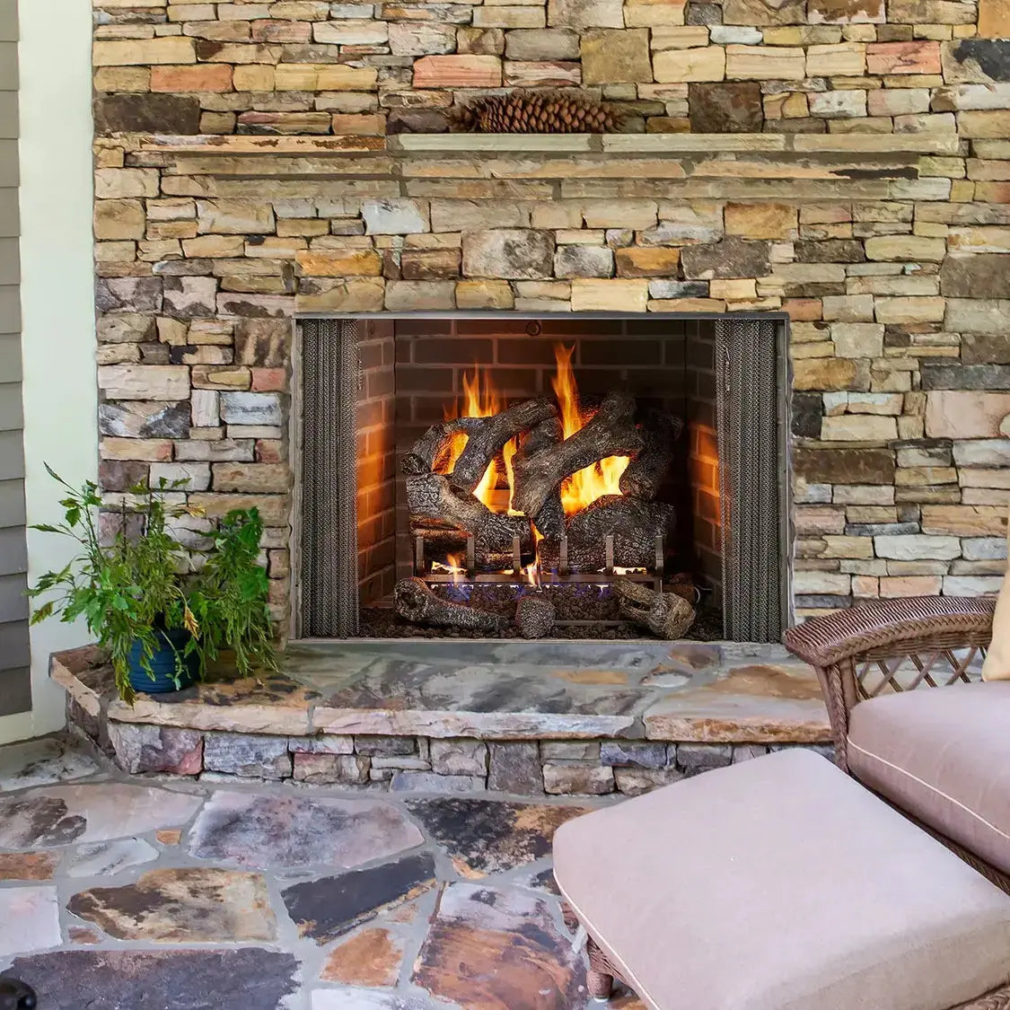 Majestic Cottagewood 36-inch outdoor wood burning fireplace with weathered wood finish and stone accents