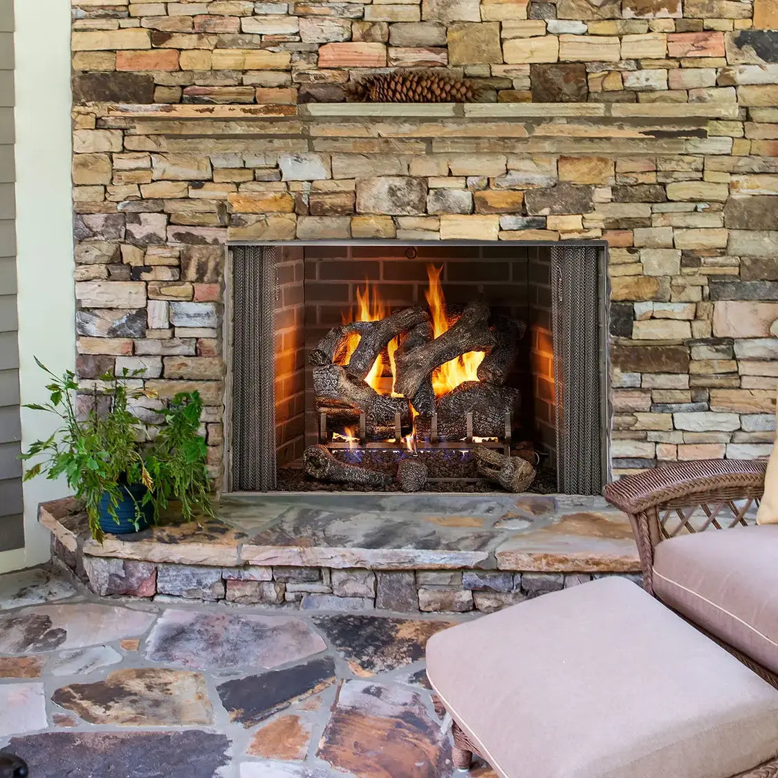Majestic Cottagewood 42-inch outdoor wood burning fireplace with weathered wood finish and stone accents