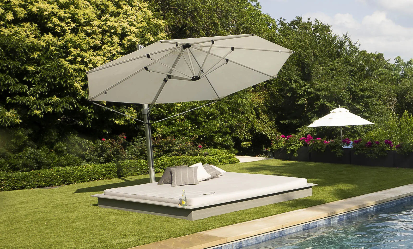 Echo Sunbeds modern folding sunbed with black leather surface and wooden frame.