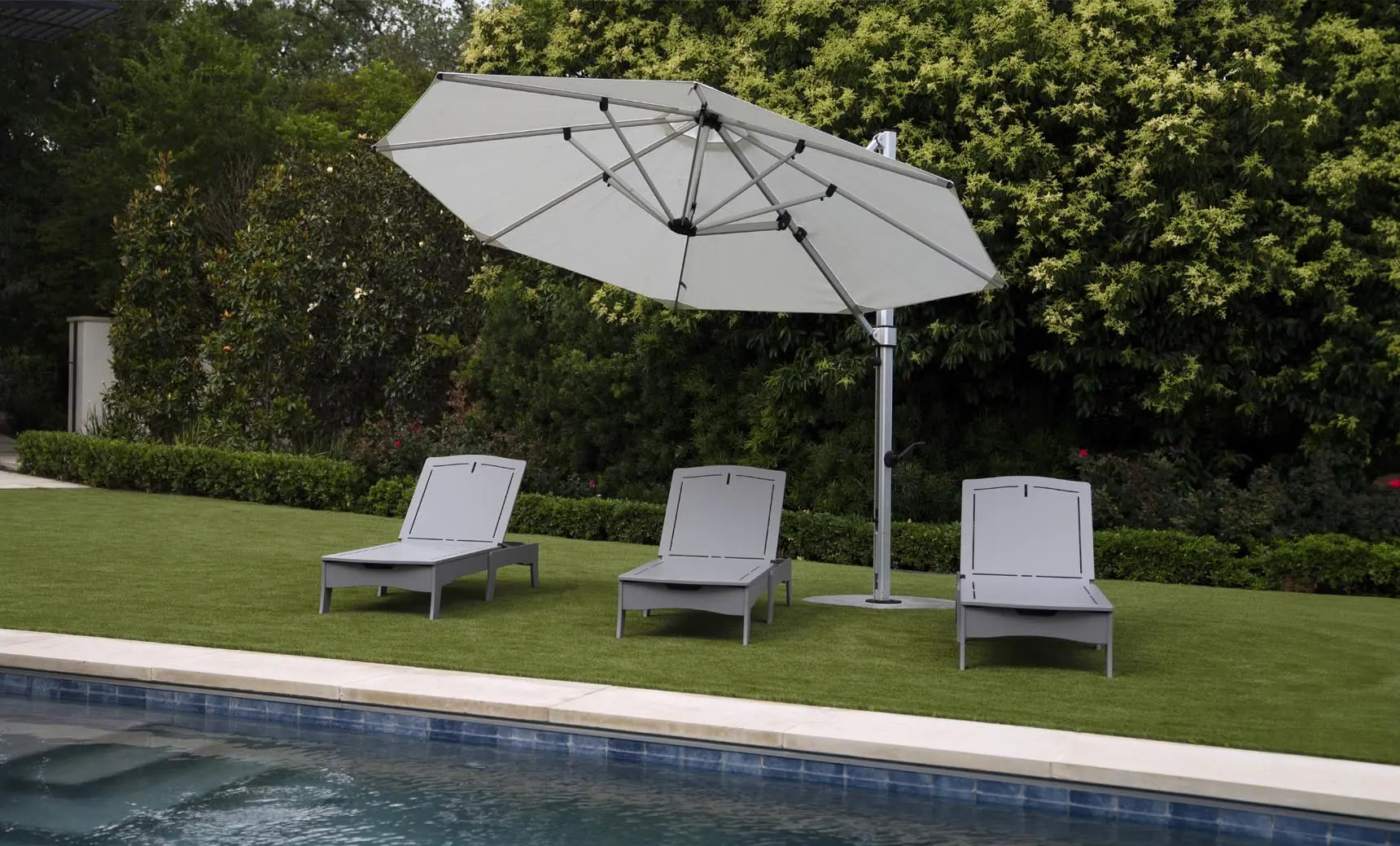 Legacy chaise lounge with brown leather upholstery, wooden frame, and armrests.