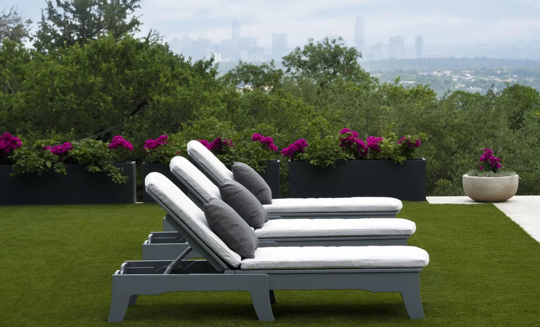 Legacy chaise lounge with brown leather upholstery, wooden frame, and armrests.