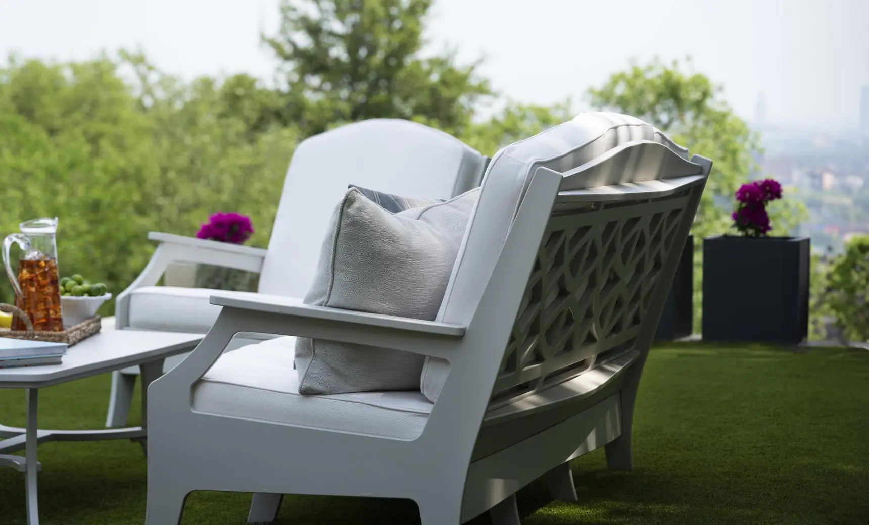 Legacy Club chair in dark brown leather with curved arms and high backrest.