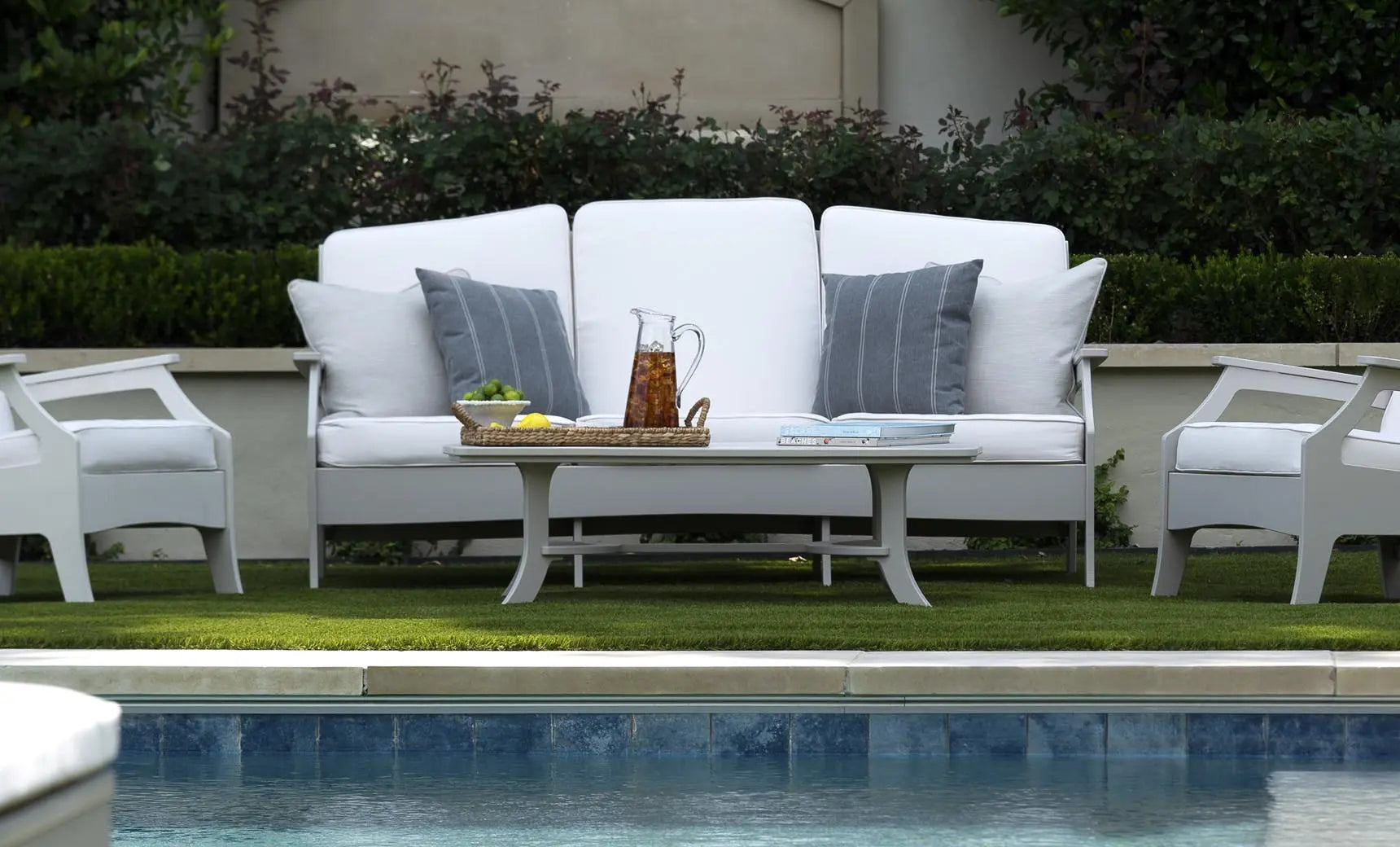 Legacy sofa in dark brown leather with curved arms and high backrest.