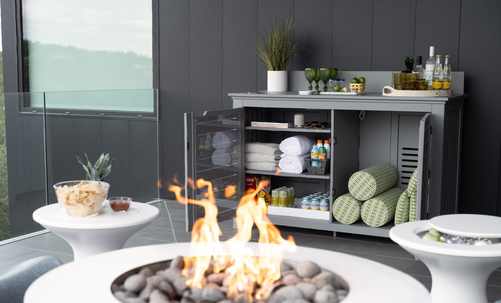 Mainstay bar credenza featuring wooden doors with glass inserts and adjustable shelving.