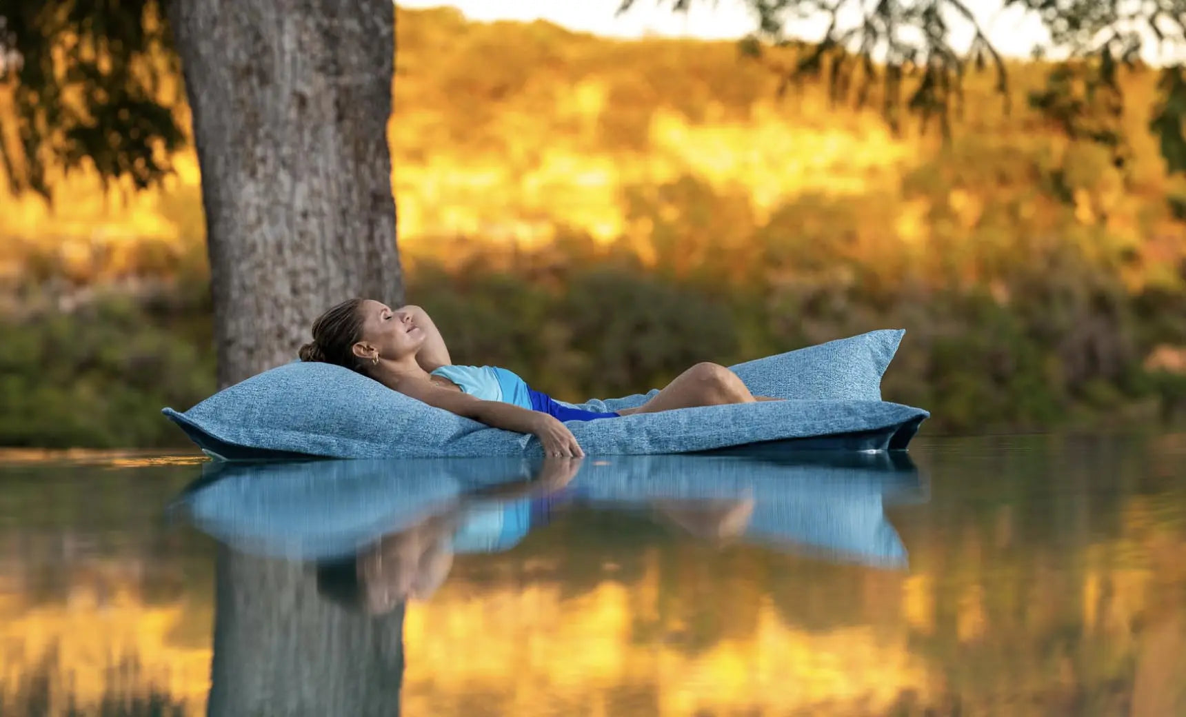 Laze Pillow in soft fabric design with a contoured shape for comfortable lounging.