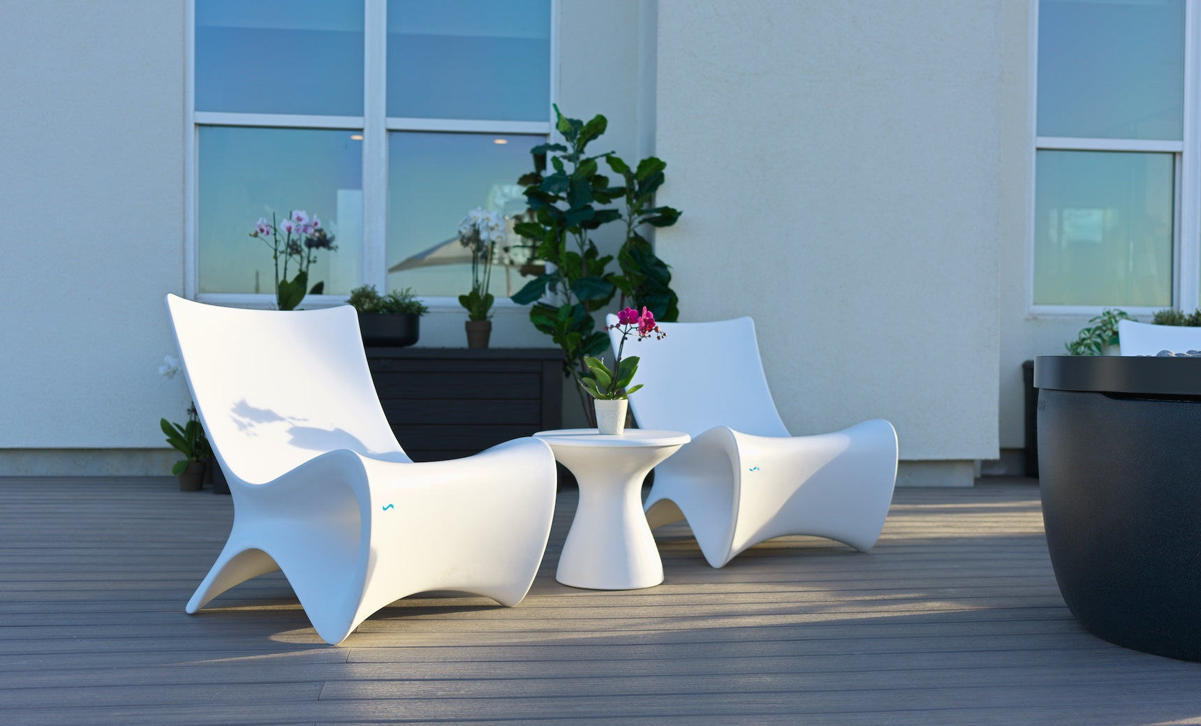 Autograph chair paired with a matching side table in walnut finish.