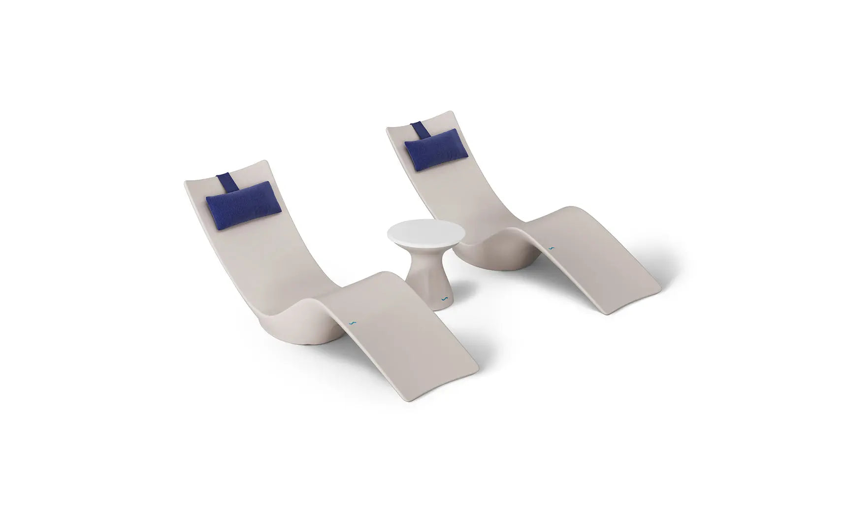 Autograph chaise lounge chair paired with a matching side table designed for poolside use.
