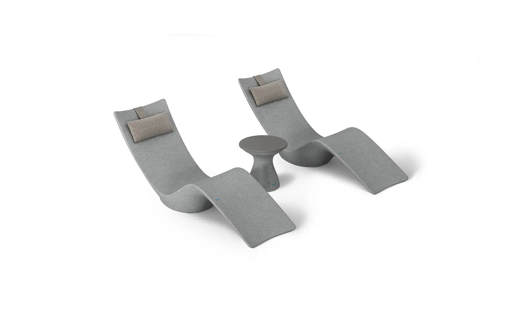 Autograph chaise lounge chair paired with a matching side table designed for poolside use.