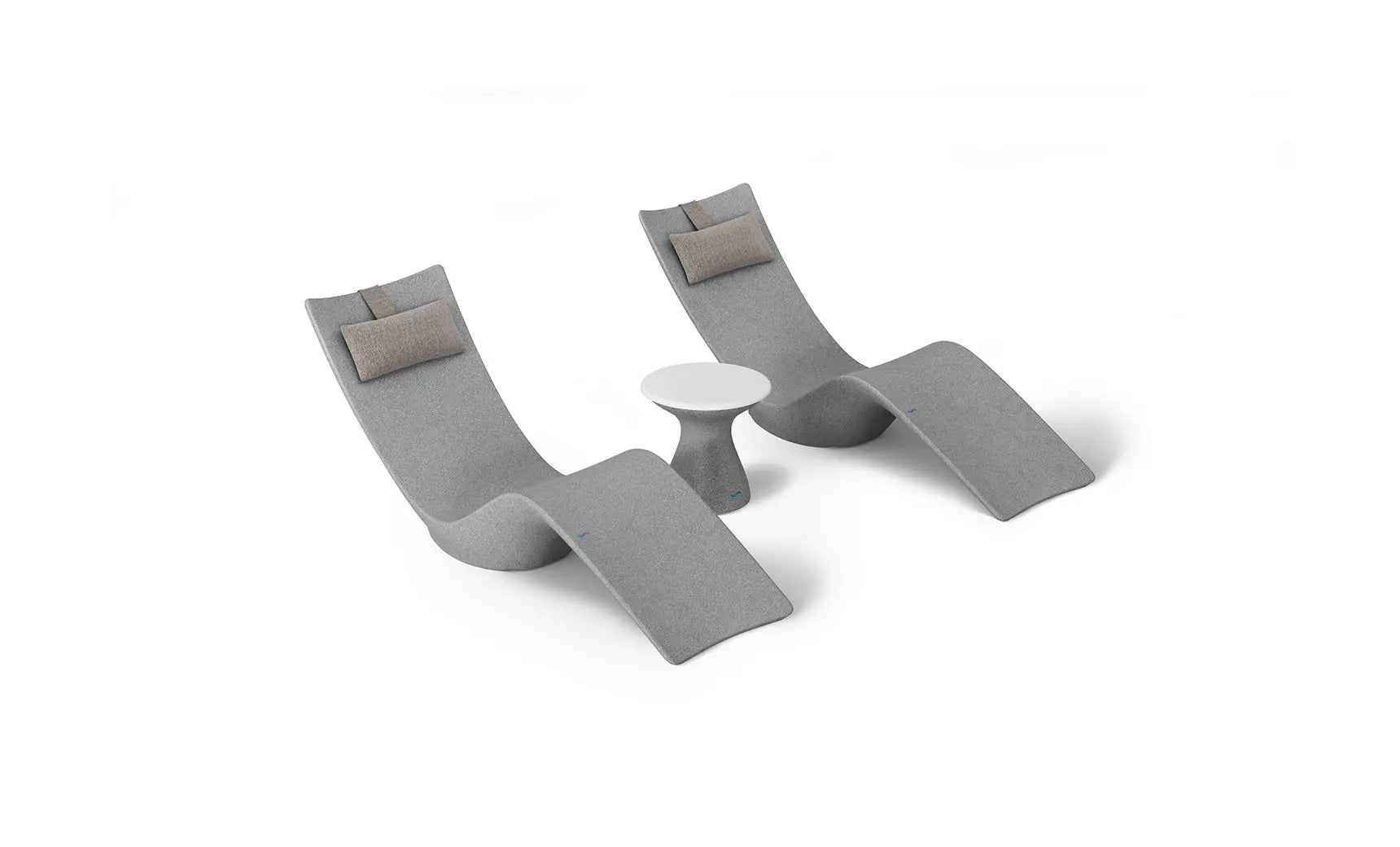 Autograph chaise lounge chair paired with a matching side table designed for poolside use.