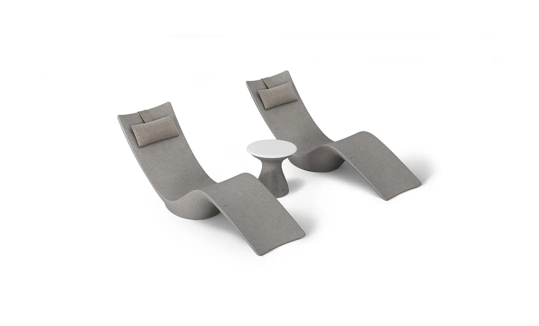Autograph chaise lounge chair paired with a matching side table designed for poolside use.