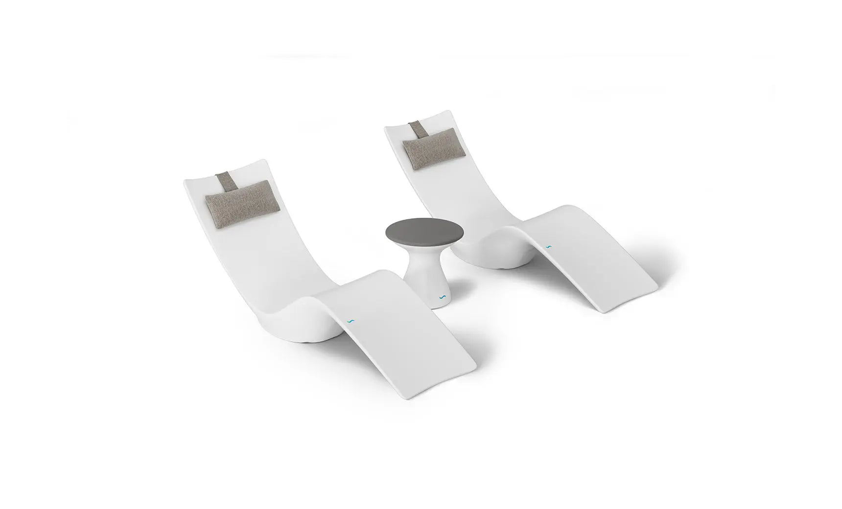 Autograph chaise lounge chair paired with a matching side table designed for poolside use.