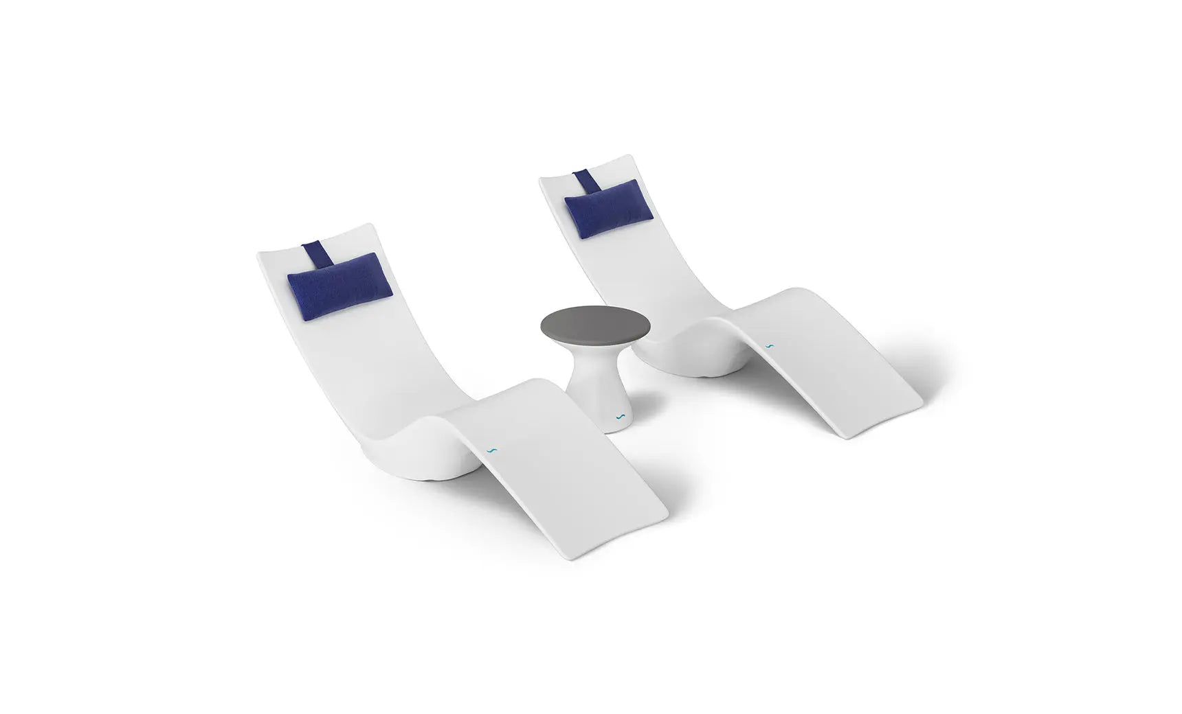 Autograph chaise lounge chair paired with a matching side table designed for poolside use.