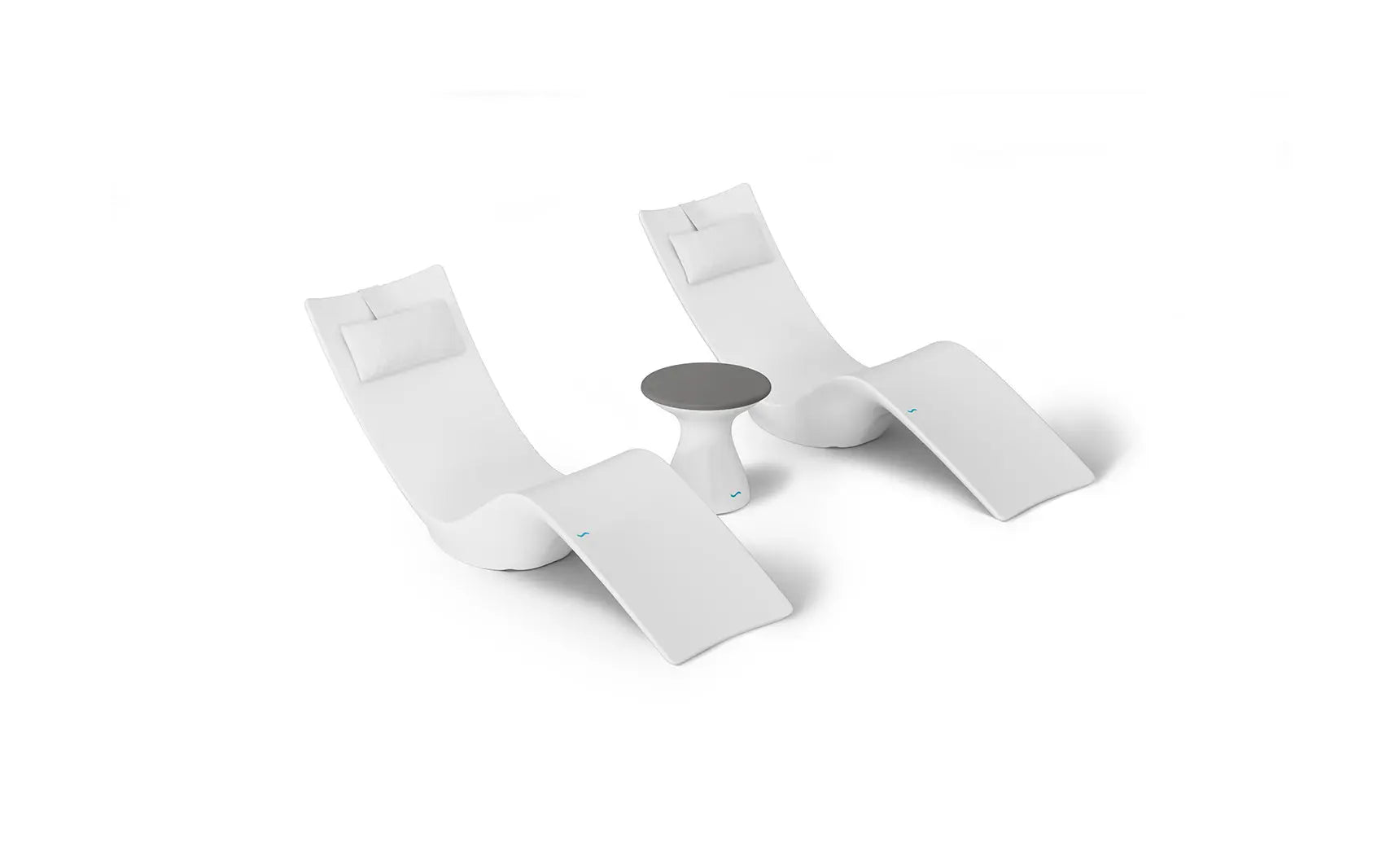 Autograph chaise lounge chair paired with a matching side table designed for poolside use.