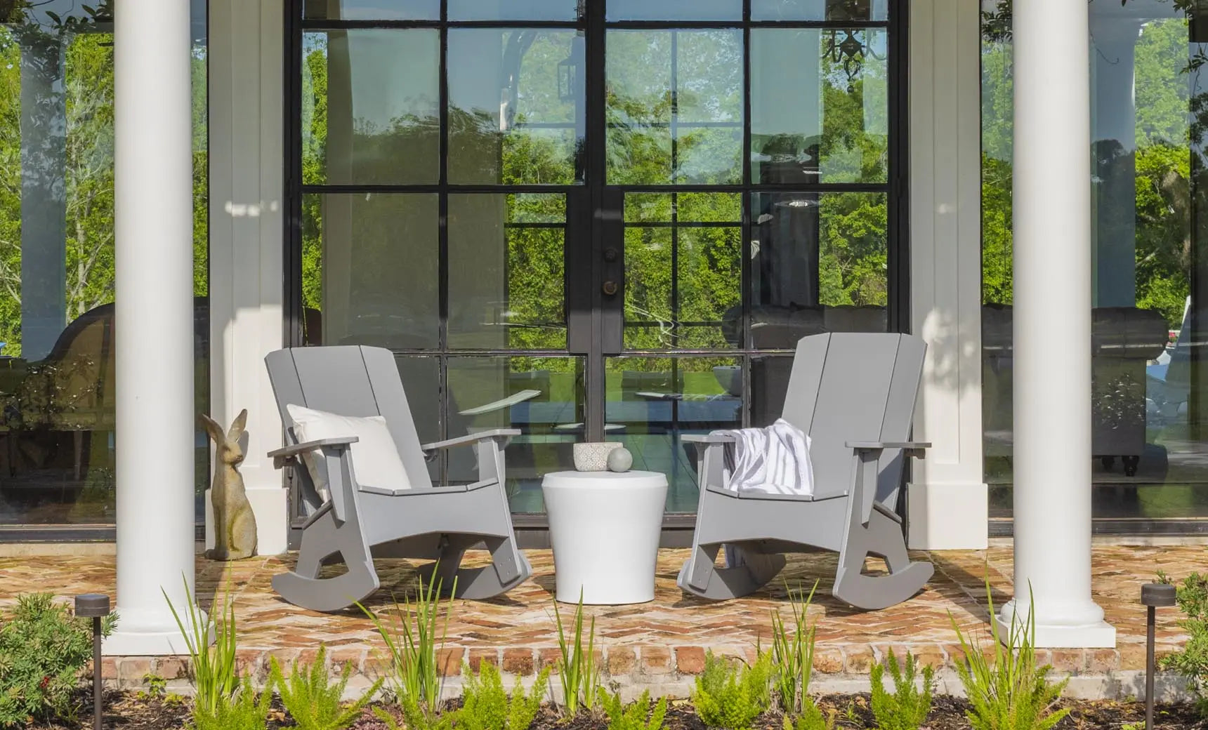 Mainstay Adirondack rocker in weathered pine finish with cushioned seat and armrests