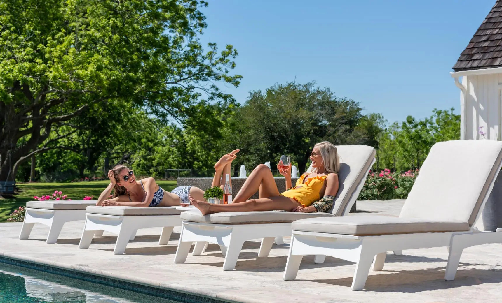 Mainstay chaise cushion in navy blue fabric with foam padding and a curved design for lounging.