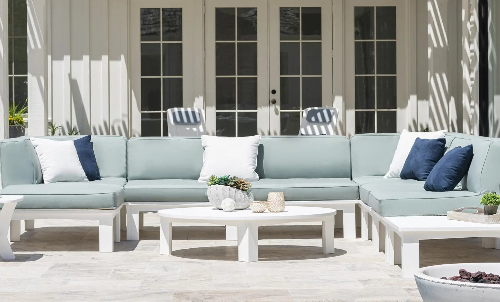 Mainstay round coffee table with a dark brown wooden top and metal legs.