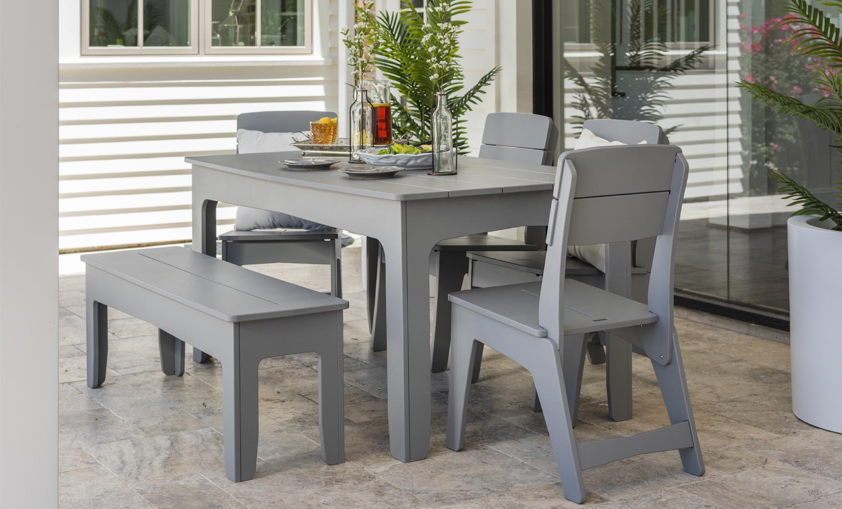 Mainstay rectangular dining table with a smooth surface and four legs.