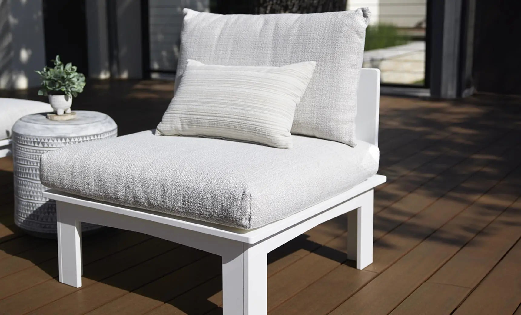 Mainstay Sectional Sofa with a relaxed middle design featuring brown fabric and wooden legs.