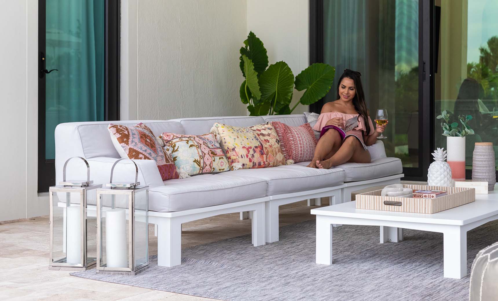Mainstay sectional middle sofa in beige with wooden legs and button-tufted backrest.