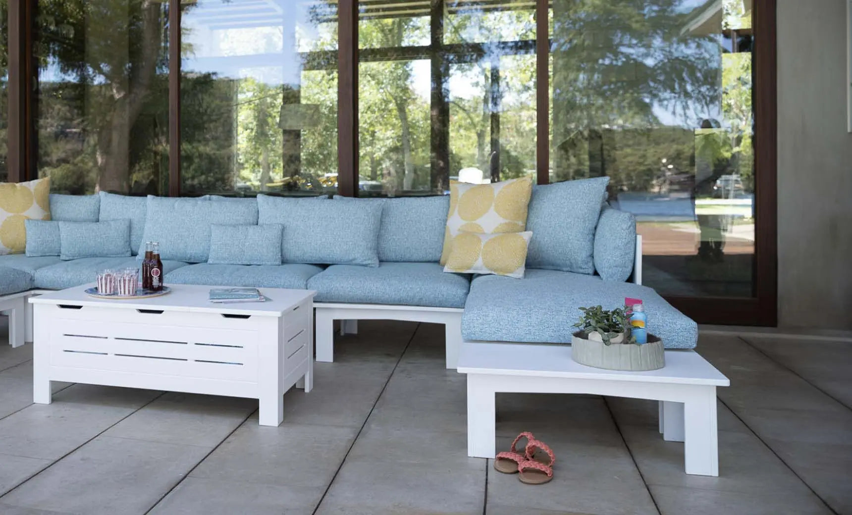 Mainstay sectional sofa in a left corner configuration with relaxed arm design and cream-colored fabric