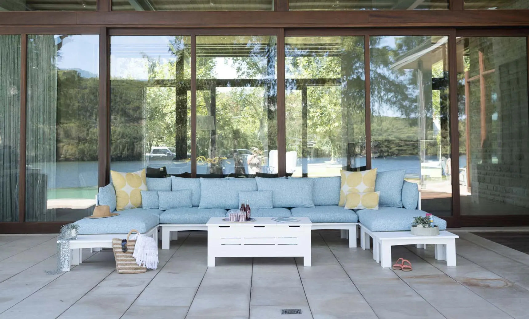 Mainstay Sectional Sofa with a relaxed middle design featuring brown fabric and wooden legs.