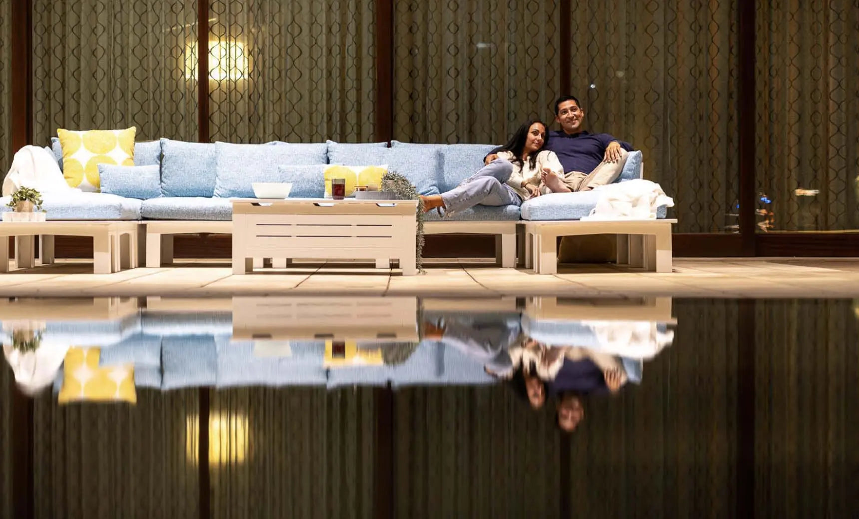 Mainstay Sectional Sofa with a relaxed middle design featuring brown fabric and wooden legs.