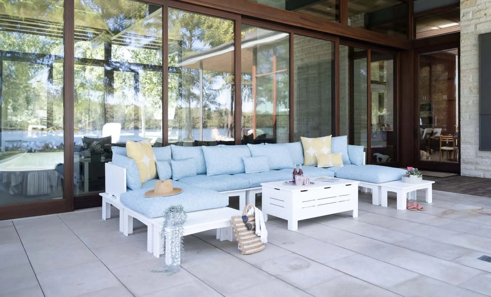 Mainstay sectional sofa in a left corner configuration with relaxed arm design and cream-colored fabric