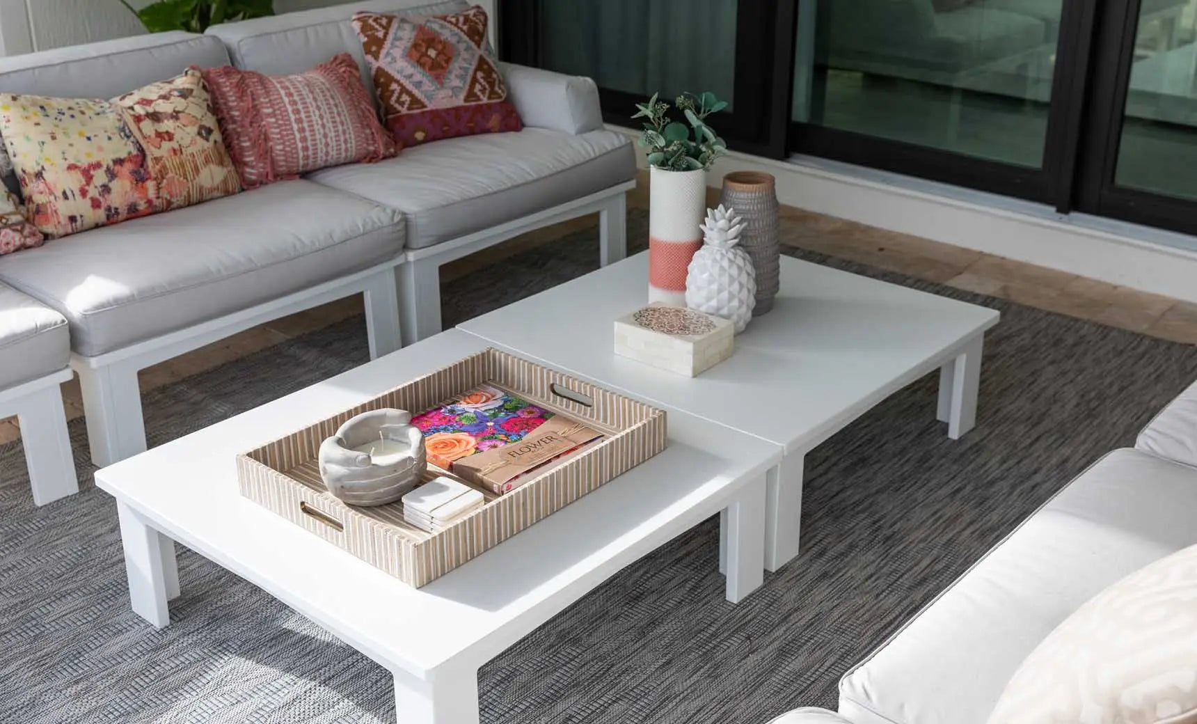 Mainstay square coffee table with a dark brown wooden top and metal legs.