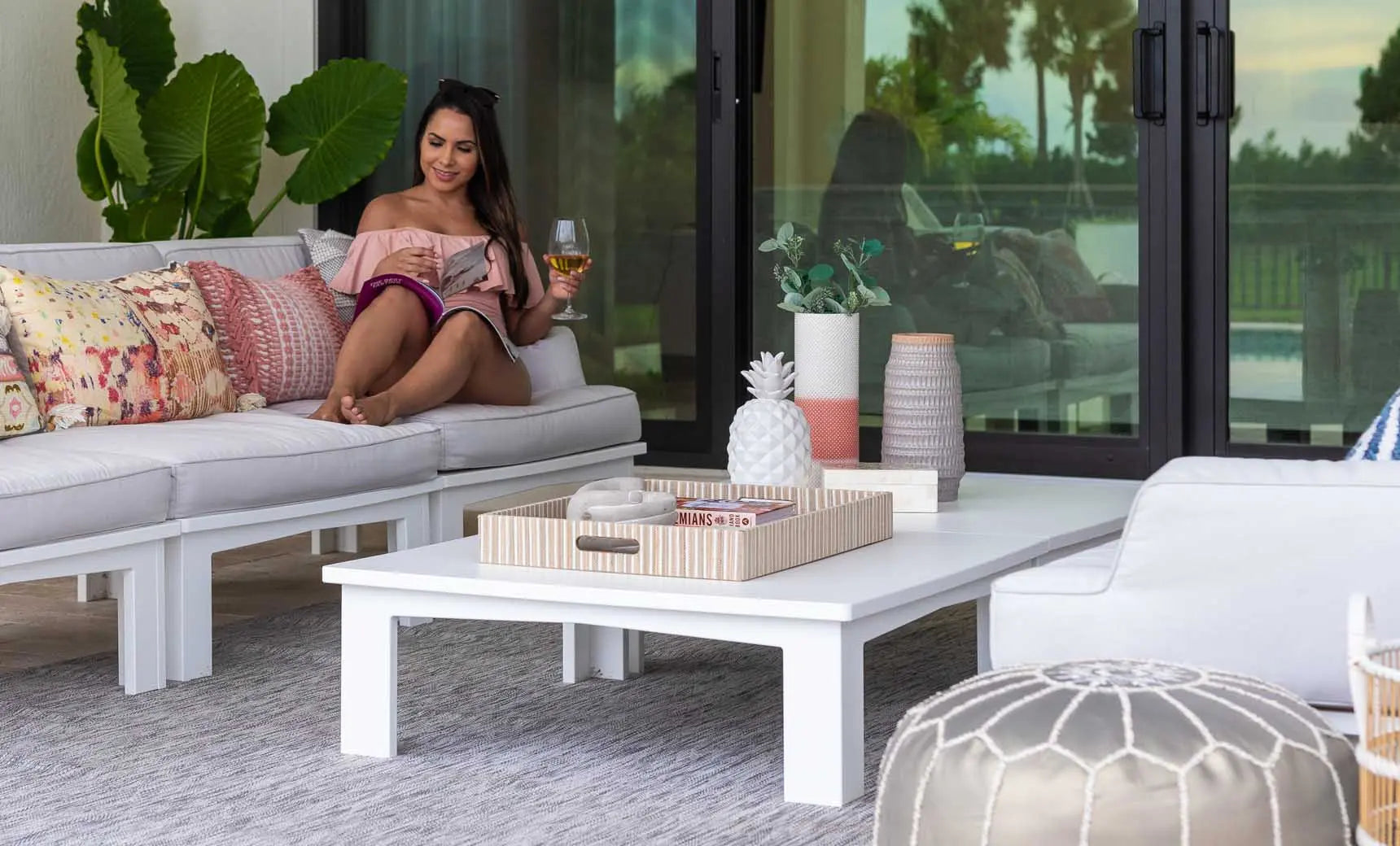 Mainstay square coffee table with a dark brown wooden top and metal legs.