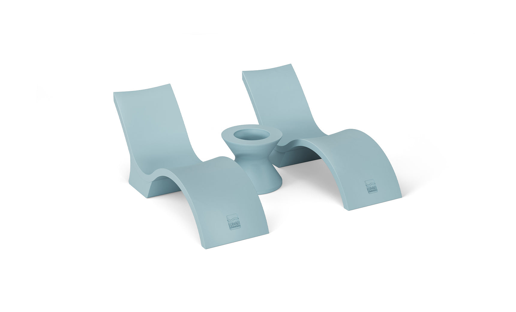 Signature Chaise lounge in pool with matching deep cushion and side table for relaxation.