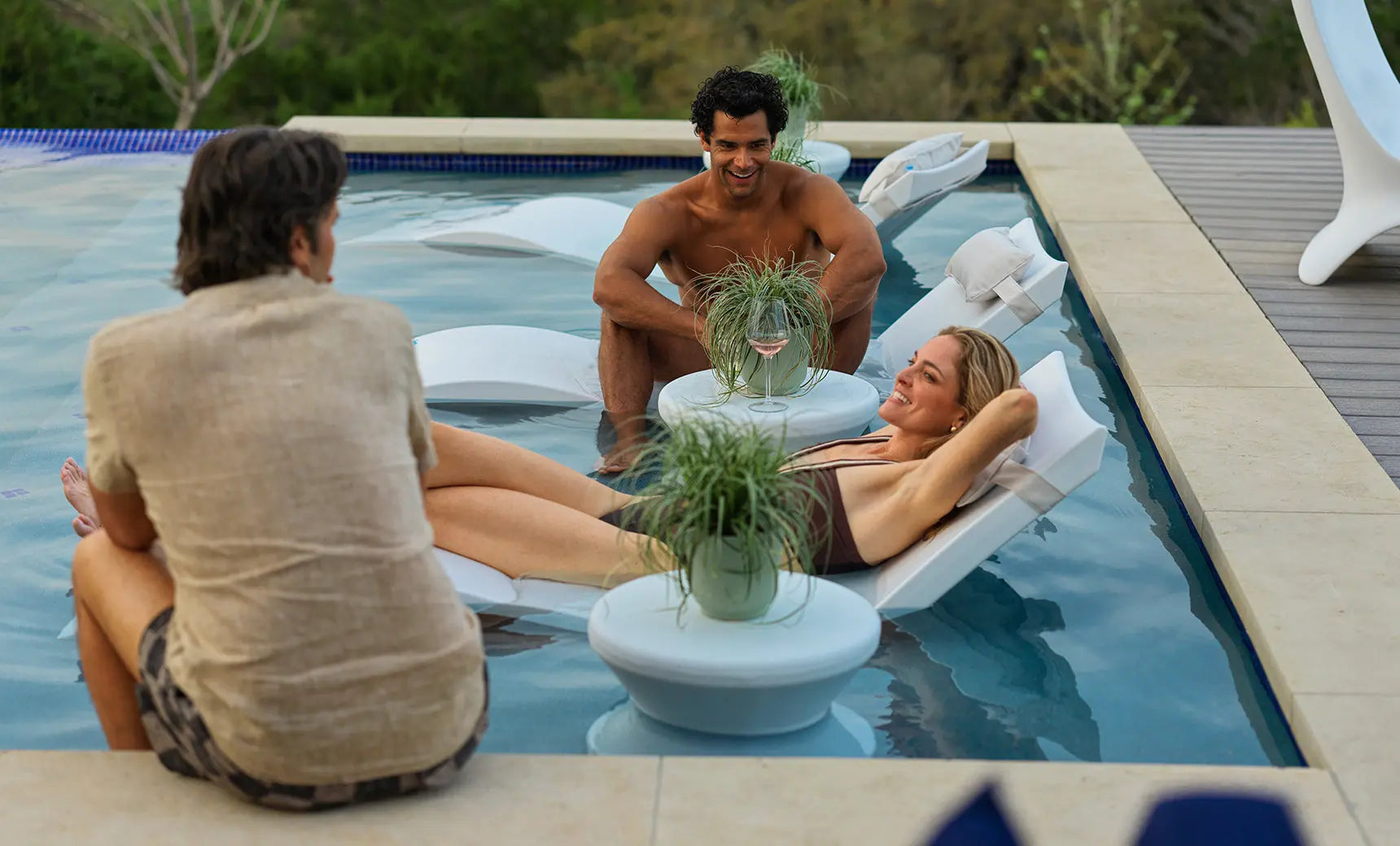 Signature pool chaise lounge set with coordinating side table in sleek black finish.