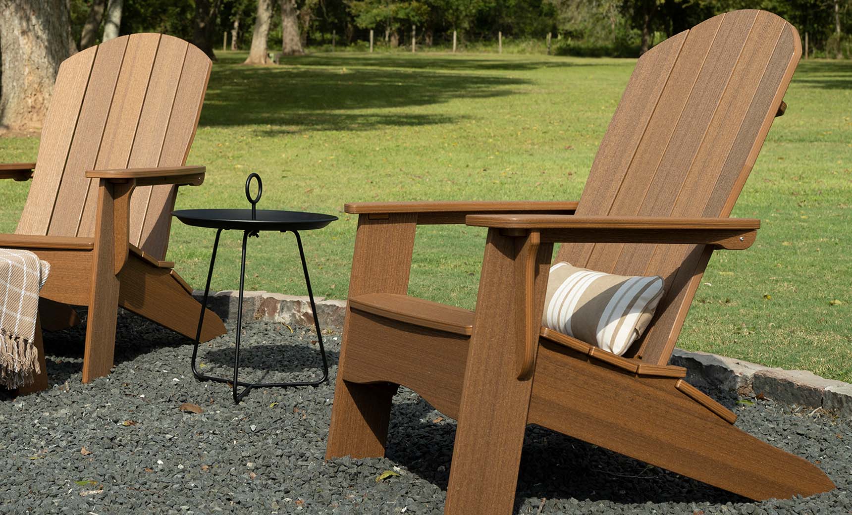 Rectangular bolster pillow in soft fabric with decorative piping along edges.