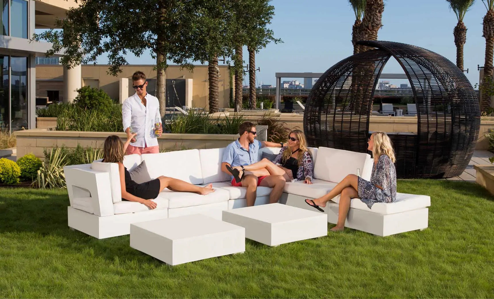 Signature coffee table with glass top and wooden legs in a modern design.