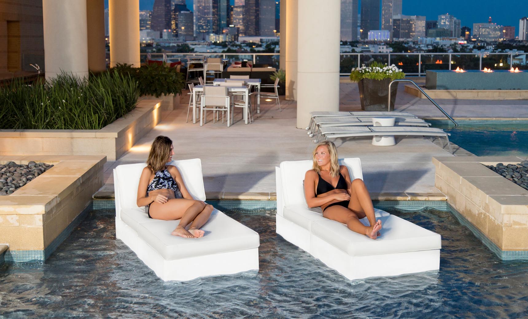 Signature Sectional 2 Piece Sun Chair in beige fabric with curved backrests and armrests.