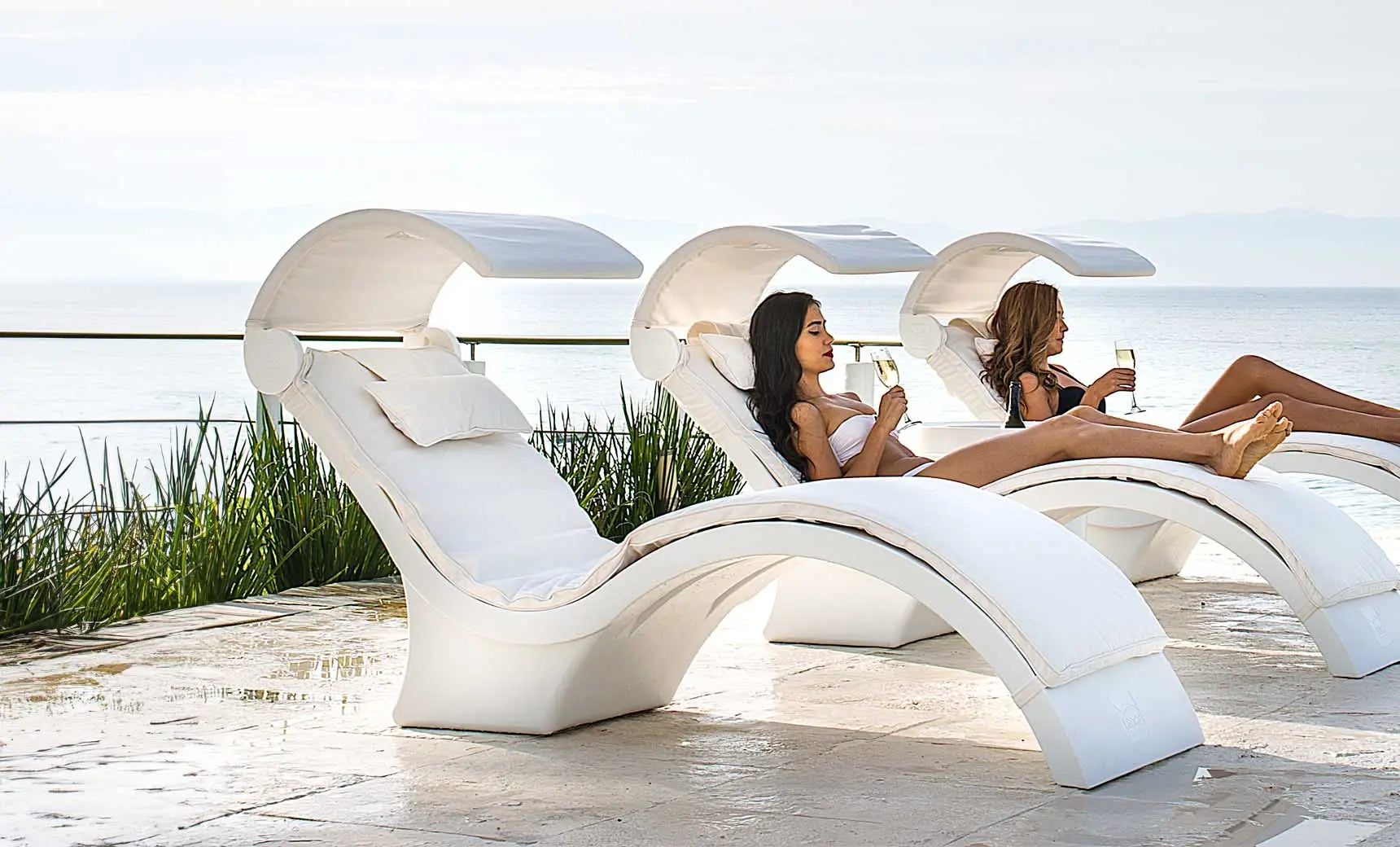 Signature chaise cushion in soft gray fabric with tufted design and button detailing.
