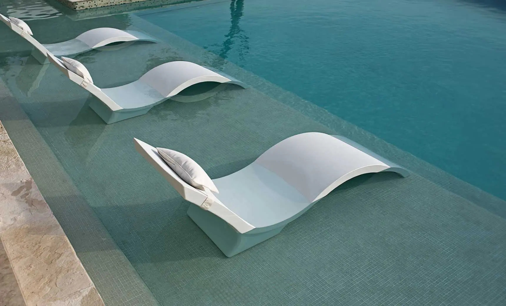 Signature Chaise deep reclining lounge chair in dark fabric with wooden frame and armrests