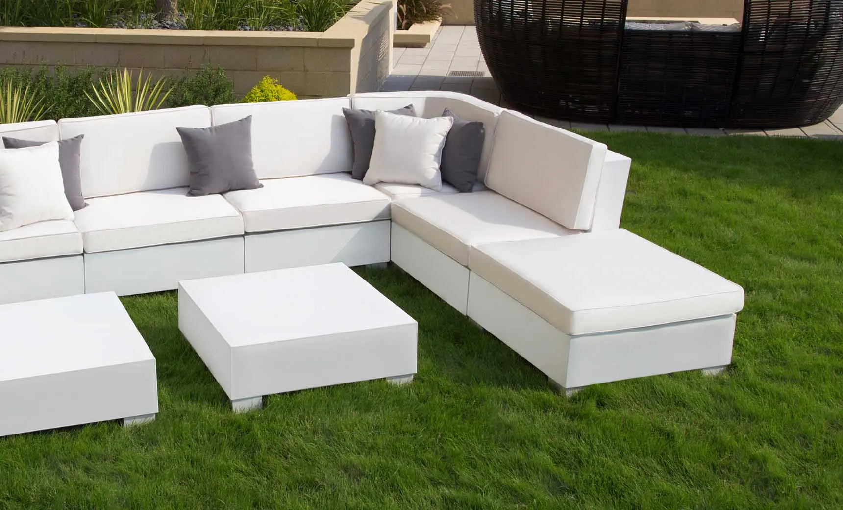 Signature Sectional Corner sofa in dark gray fabric with wooden legs and armrests.