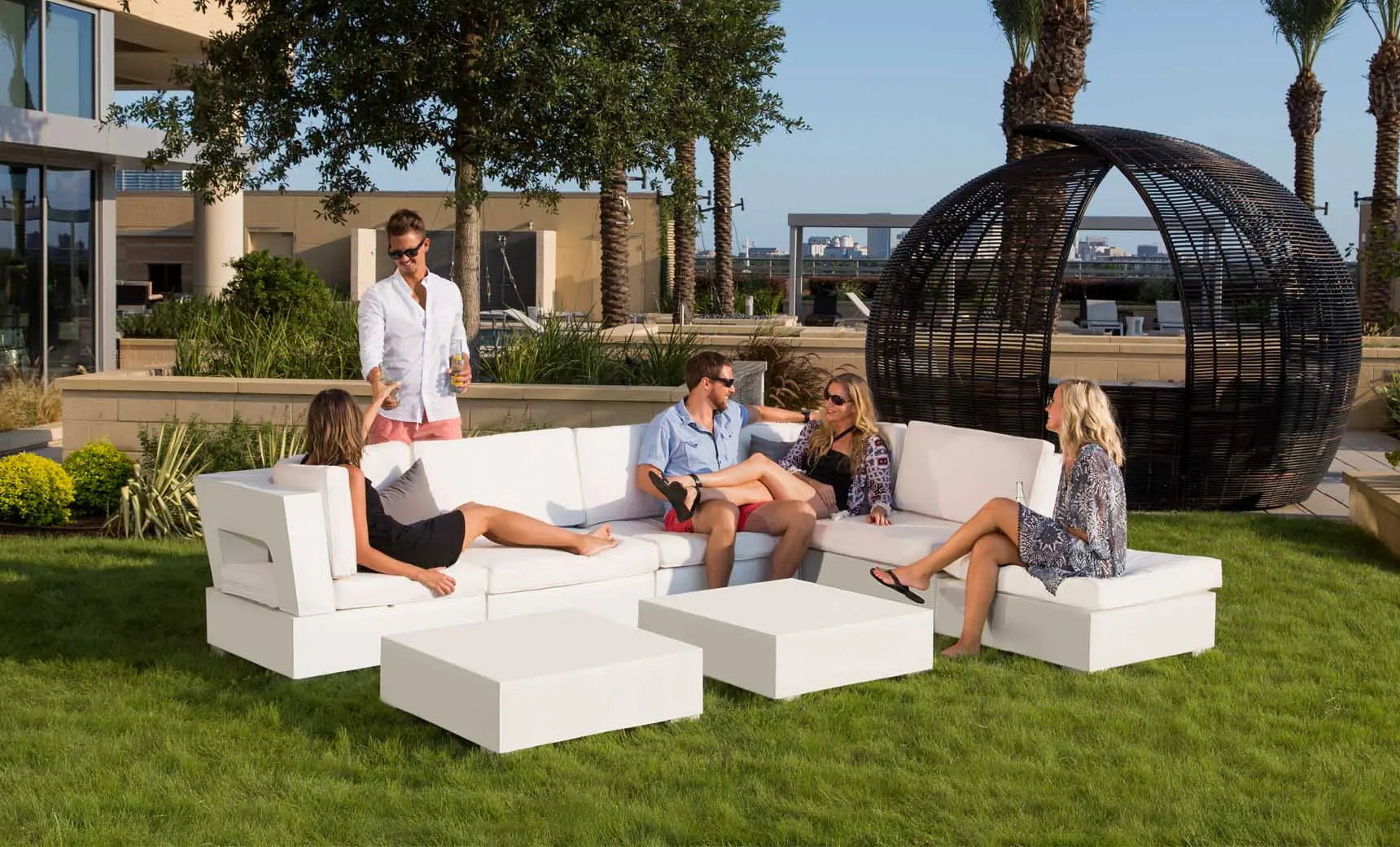 Signature Sectional Corner sofa in dark gray fabric with wooden legs and armrests.