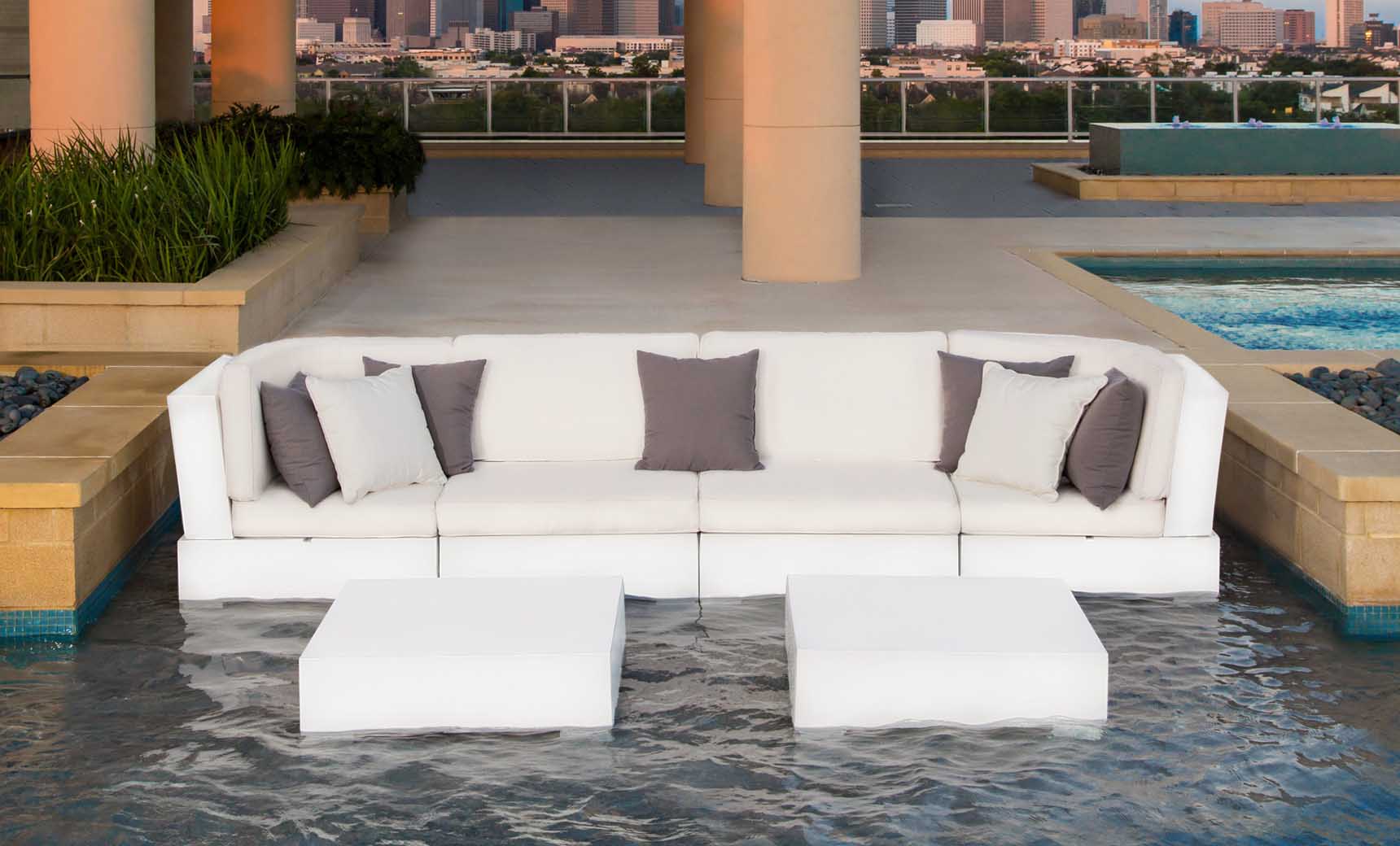 Signature Sectional Middle sofa in beige fabric with wooden legs and curved arms.