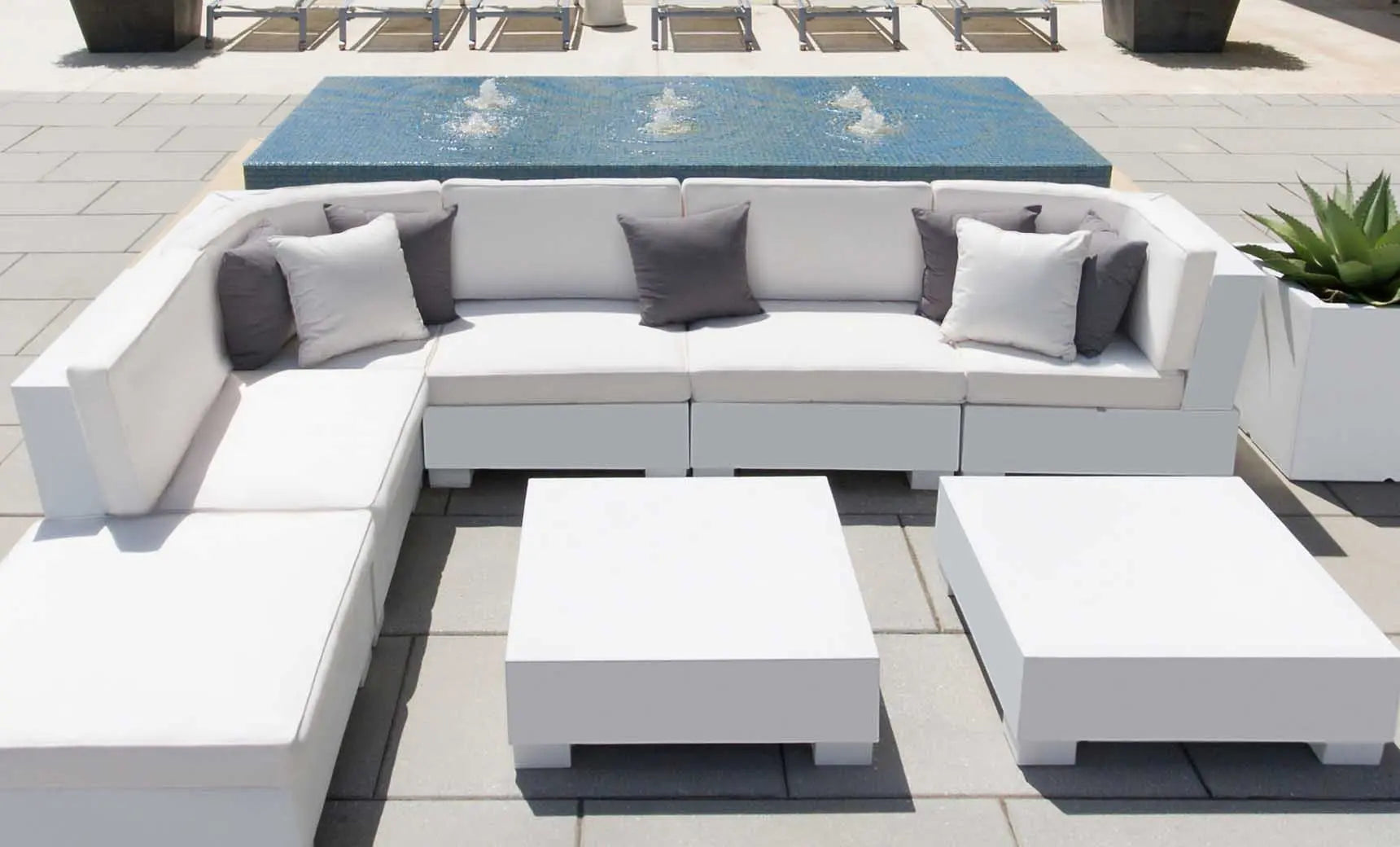 Signature Sectional Middle sofa in beige fabric with wooden legs and curved arms.