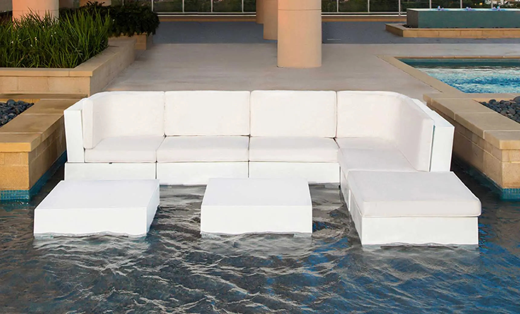 Signature Sectional Middle sofa in beige fabric with wooden legs and curved arms.