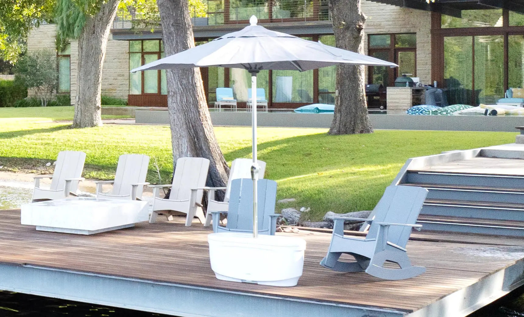 PartyPad swim-up bar with blue and white umbrella, ice bucket, and drinks on a pool deck.