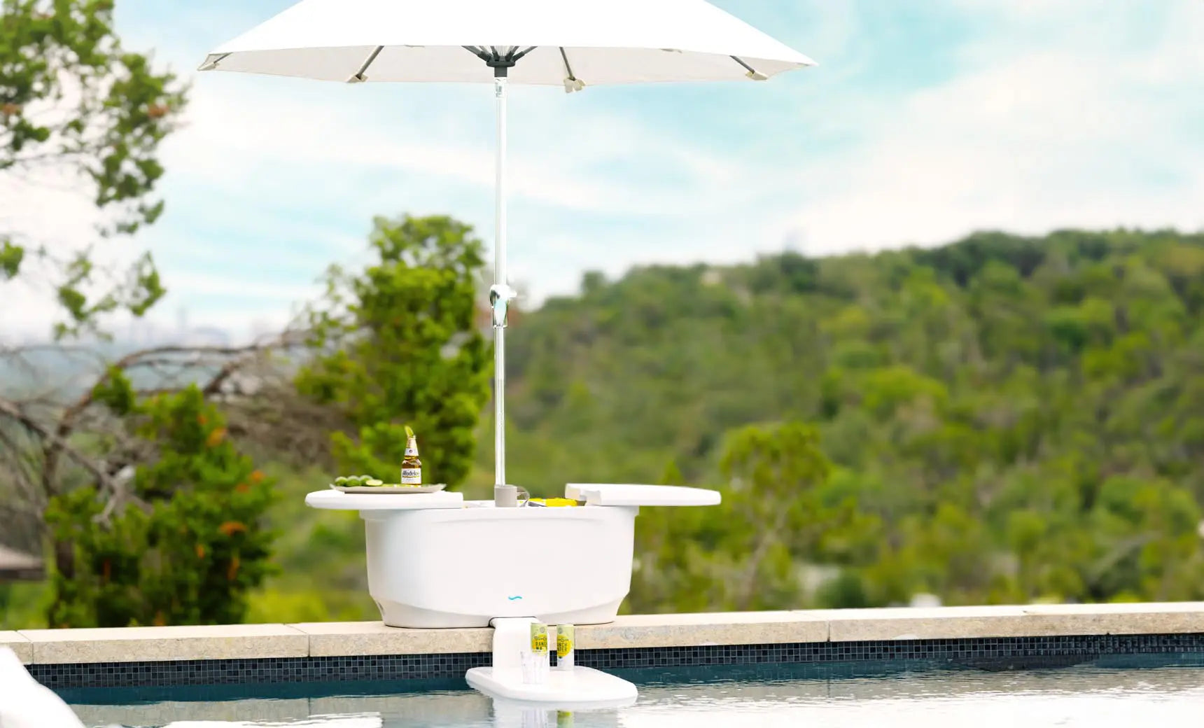 PartyPad swim-up bar with blue and white umbrella, red cooler, and drinks on ice.