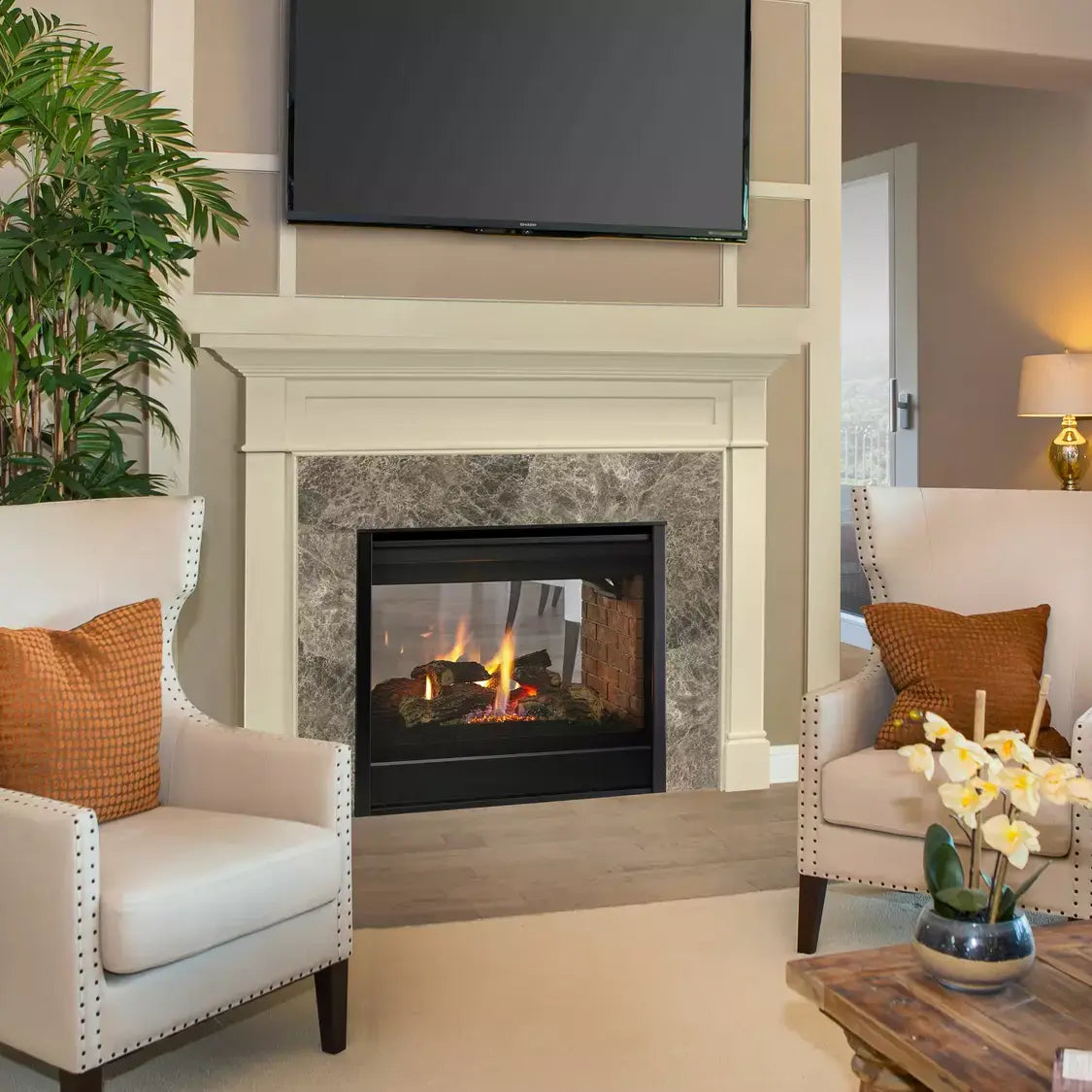 Majestic See-Through 36" direct vent gas fireplace with glass front and metal frame.