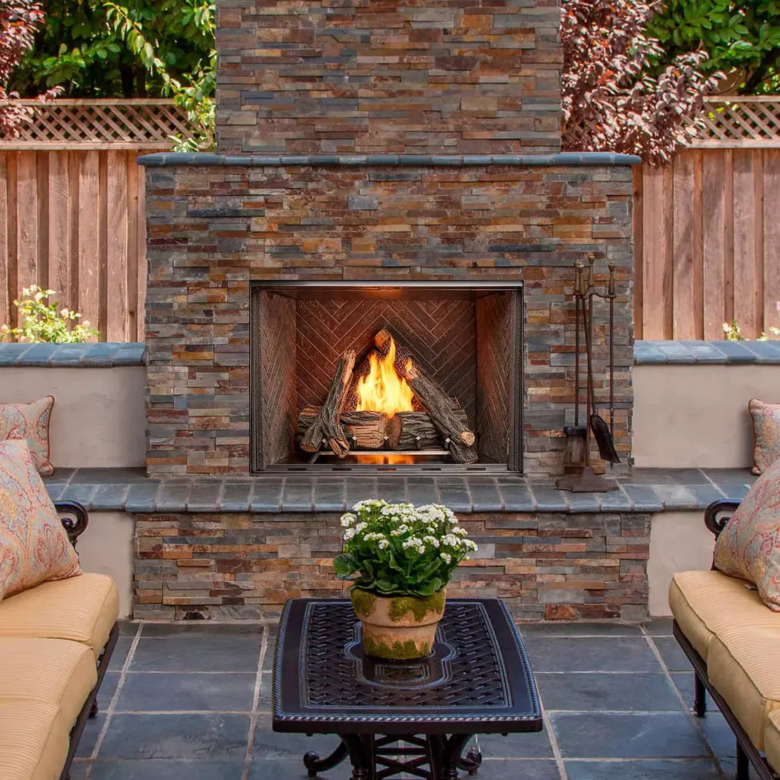 Majestic Courtyard 36" outdoor gas fireplace with modern design and glass front panel.