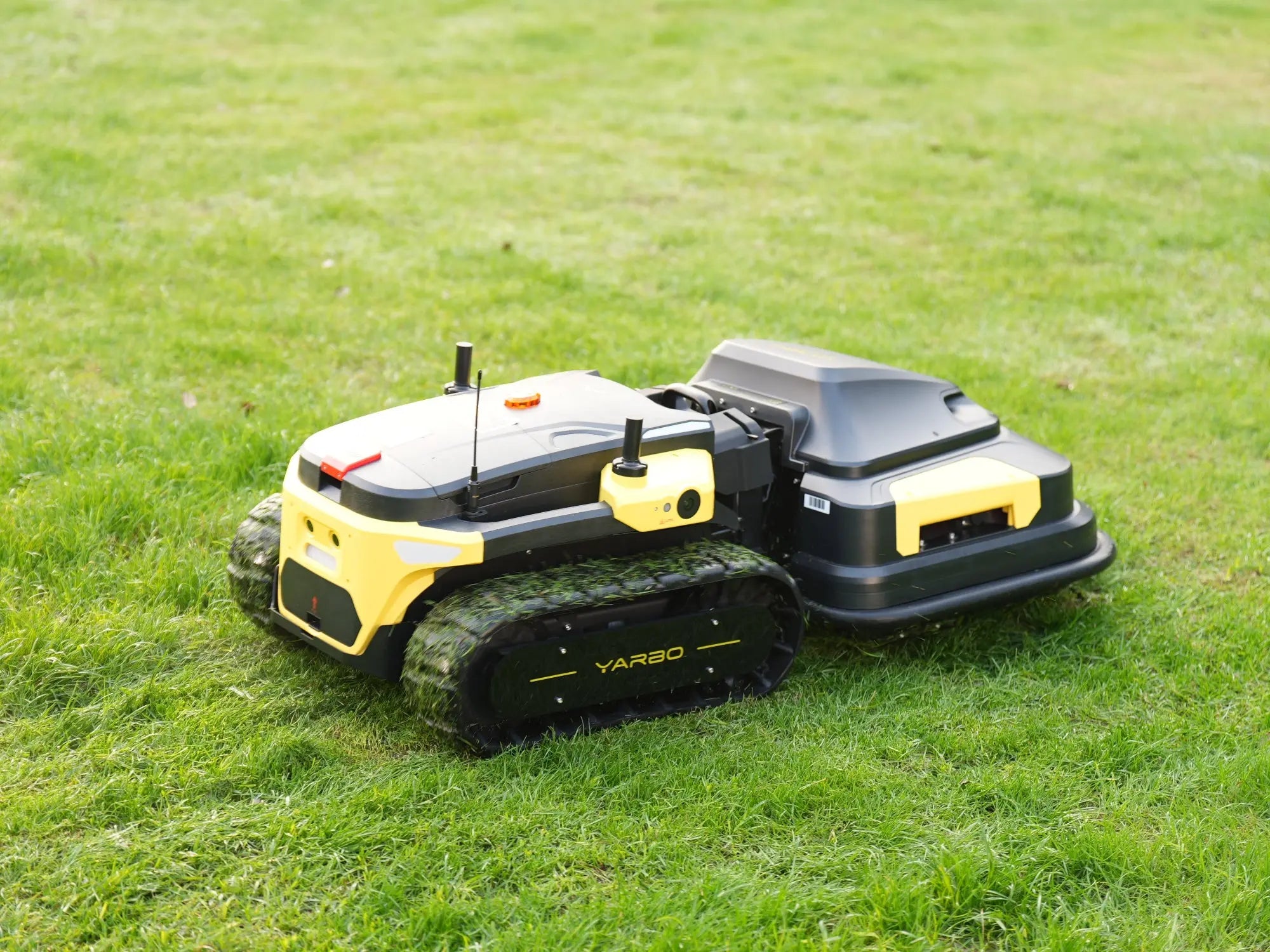 Robotic lawn mower on a grassy field