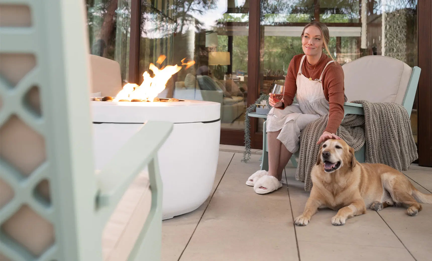 Halo firepit with gray stone surround and blue flame feature