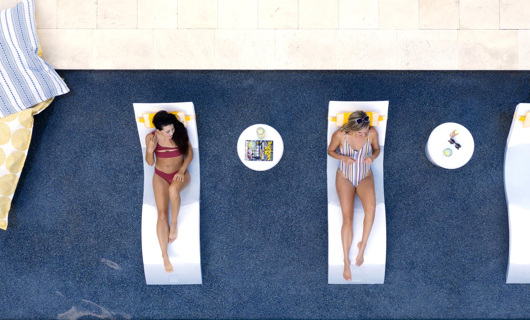 Signature pool chaise lounge set with coordinating side table in modern design.